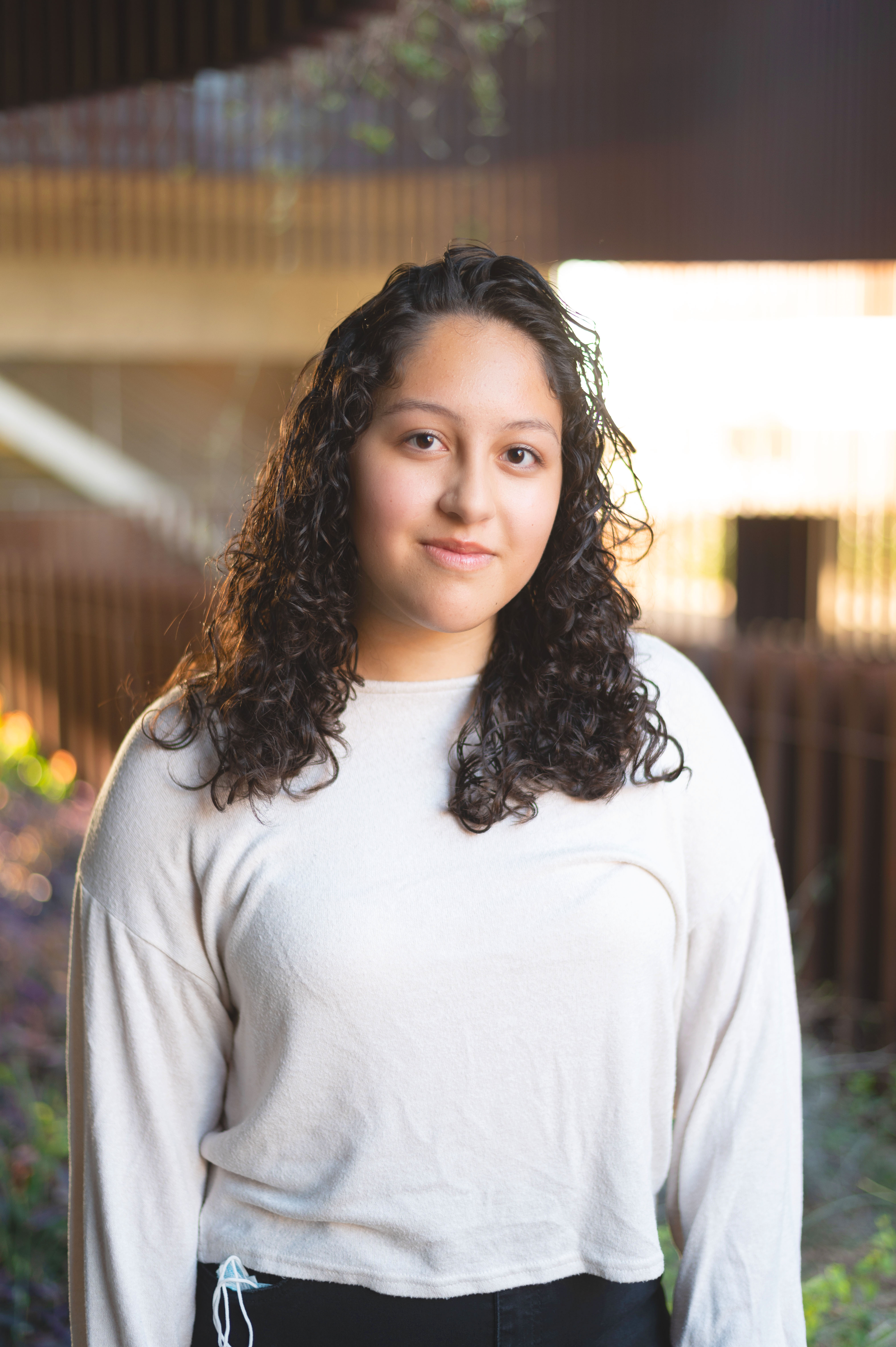 A person outside in a white shirt