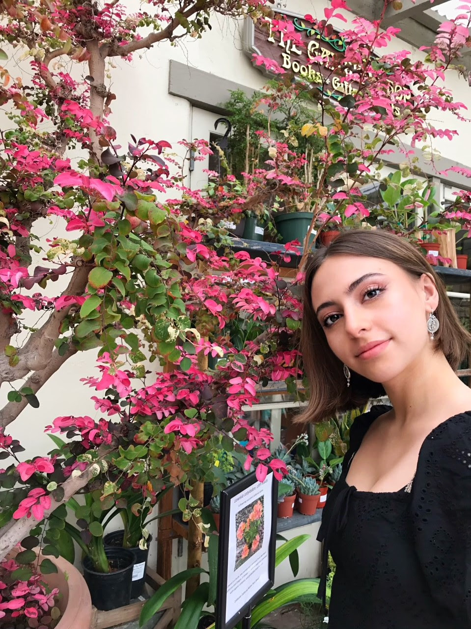 Sam Wetherell standing in front of a blooming tree