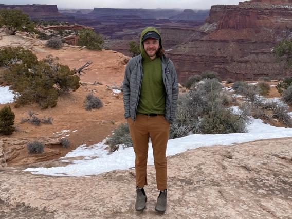 Nic Katz standing above the Grand Canyon