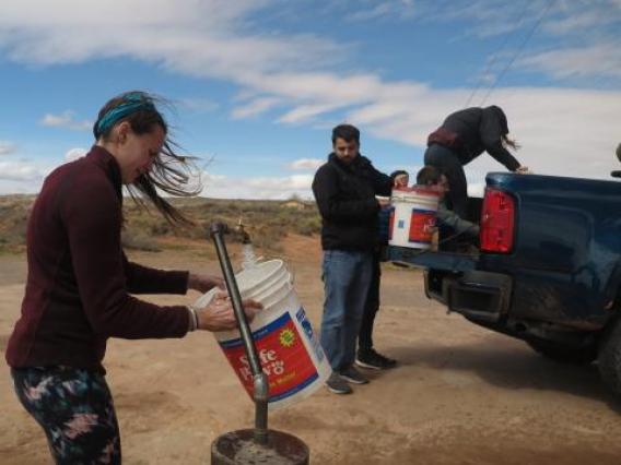 Girl filling bucket