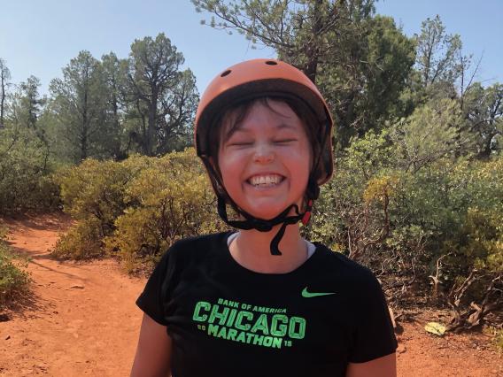 Peyton Smith smiling on a Sedona mountain bike trail