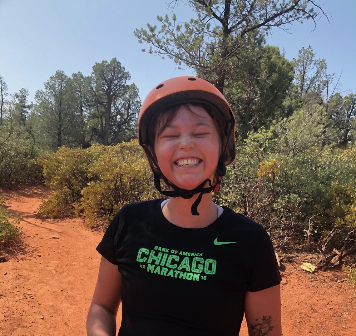 Peyton Smith smiling on a Sedona mountain bike trail