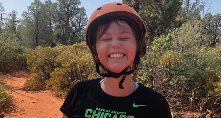 Peyton Smith smiling on a Sedona mountain bike trail